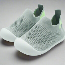 Load image into Gallery viewer, Crafted for comfort and stability, these first walker shoes are perfect for little ones taking their first steps. The soft, breathable knit upper provides a snug yet flexible fit, allowing tiny feet to move naturally and comfortably. With a lightweight, non-slip sole, these shoes offer essential grip and support as your baby learns to walk with confidence