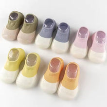 Load image into Gallery viewer, Tiny Urban Walkers Sock Shoes – Soft and breathable sock shoes designed for new walkers. Featuring a stretchy knit upper for comfort and flexibility, with a lightweight, non-slip sole for stability on any surface. These slip-on shoes are perfect for indoor and outdoor play, offering superior traction and protection with a rubber anti-collision toe cap. Available in pastel colors, they provide both style and support for your baby's first steps."
