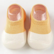 Load image into Gallery viewer, Tiny Urban Walkers Sock Shoes – Soft and breathable sock shoes designed for new walkers. Featuring a stretchy knit upper for comfort and flexibility, with a lightweight, non-slip sole for stability on any surface. These slip-on shoes are perfect for indoor and outdoor play, offering superior traction and protection with a rubber anti-collision toe cap. Available in pastel colors, they provide both style and support for your baby's first steps."