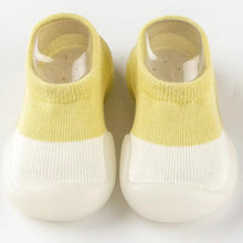 Load image into Gallery viewer, Tiny Urban Walkers Sock Shoes – Soft and breathable sock shoes designed for new walkers. Featuring a stretchy knit upper for comfort and flexibility, with a lightweight, non-slip sole for stability on any surface. These slip-on shoes are perfect for indoor and outdoor play, offering superior traction and protection with a rubber anti-collision toe cap. Available in pastel colors, they provide both style and support for your baby's first steps."