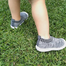 Load and play video in Gallery viewer, Luna Sneaker – Exclusive first walker sneakers for toddlers, made with breathable woven linen fabric and cushioned, flexible rubber soles. These sneakers feature moisture-wicking fabric to keep feet dry, a roomy toe section for wiggle room, and a stretchy pull-on design with no laces. Ideal for first walkers, they provide comfort, support, and stability with non-slip soles and cushioned insoles.