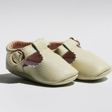 Load image into Gallery viewer, Manhattan T-Bar Moccasins – Modern leather moccasins with classic adjustable t-bar straps and side buckles. Featuring soft, flexible soles for comfort and freedom of movement, these moccasins have a scalloped edging detail, cushioned ankles, and cotton insoles. Ideal for little feet, they provide a barefoot feel with stylish and functional design.