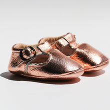 Load image into Gallery viewer, Manhattan T-Bar Moccasins – Modern leather moccasins with classic adjustable t-bar straps and side buckles. Featuring soft, flexible soles for comfort and freedom of movement, these moccasins have a scalloped edging detail, cushioned ankles, and cotton insoles. Ideal for little feet, they provide a barefoot feel with stylish and functional design.
