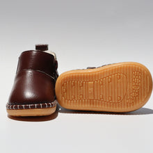 Load image into Gallery viewer, First Walker Boots – Comfortable and protective boots for toddlers, made with water-resistant leather and flexible, non-slip rubber soles. Featuring a cotton-fleece lined interior for added comfort, rounded toes for wiggle room, and elastic gussets with side zippers for easy on/off. These versatile unisex boots are perfect for outdoor adventures while providing freedom of movement for little explorers.