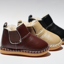 Load image into Gallery viewer, First Walker Boots – Comfortable and protective boots for toddlers, made with water-resistant leather and flexible, non-slip rubber soles. Featuring a cotton-fleece lined interior for added comfort, rounded toes for wiggle room, and elastic gussets with side zippers for easy on/off. These versatile unisex boots are perfect for outdoor adventures while providing freedom of movement for little explorers.