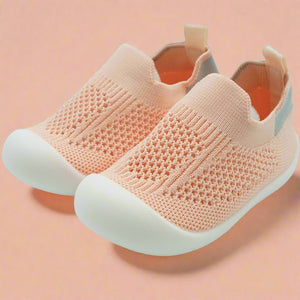 Crafted for comfort and stability, these first walker shoes are perfect for little ones taking their first steps. The soft, breathable knit upper provides a snug yet flexible fit, allowing tiny feet to move naturally and comfortably. With a lightweight, non-slip sole, these shoes offer essential grip and support as your baby learns to walk with confidence