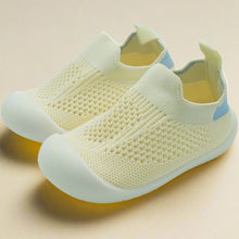 Load image into Gallery viewer, Crafted for comfort and stability, these first walker shoes are perfect for little ones taking their first steps. The soft, breathable knit upper provides a snug yet flexible fit, allowing tiny feet to move naturally and comfortably. With a lightweight, non-slip sole, these shoes offer essential grip and support as your baby learns to walk with confidence
